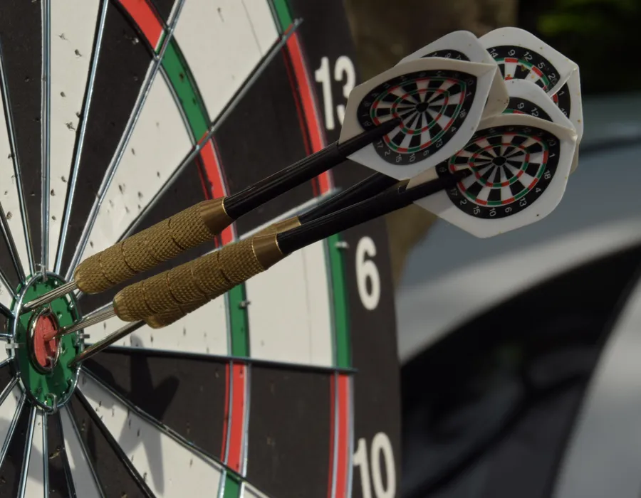 Darts hitting a target